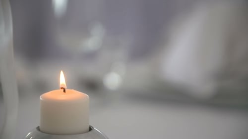 White Candle Flame in Silver Holder