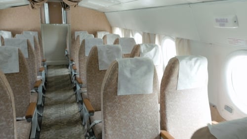 Empty Airplane Cabin with Seats and Windows