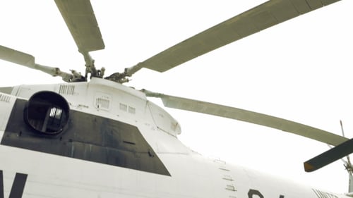 United Nations Helicopter on Grassy Field During Day