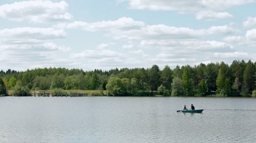 A Boat Is Floating On a Wide River