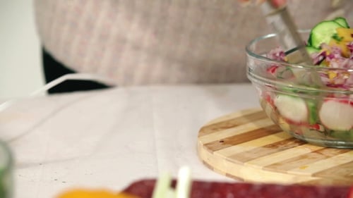 Preparing a Delicious Colorful Vegetable Salad at Home