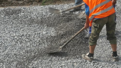 Workers With Shovel At Construction Works