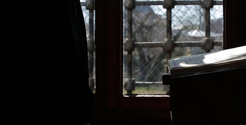 Reading a religious text in historic setting