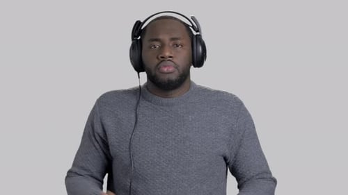Man Dancing Energetically with Headphones On