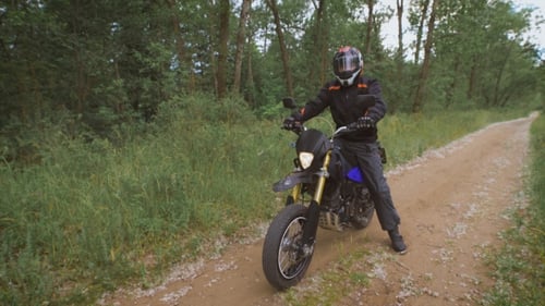 Bike Rides Along the Dirt Path Among the Trees And Bushes