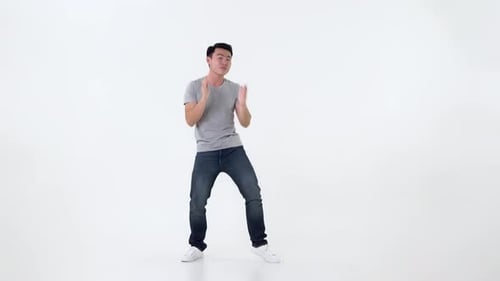 Man Dancing and Raising Hands on White Background