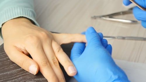 Nail Filing for Manicure by Technician with Gloves