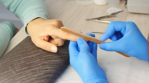 Manicurist Filing Fingernails Close-up