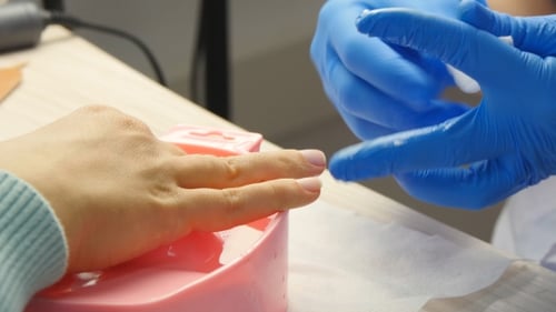 Manicurist Giving Manicure at Nail Salon