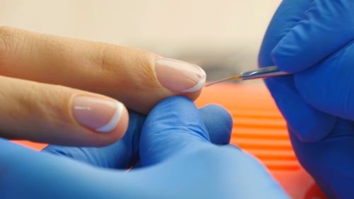 Applying White Nail Polish for French Manicure