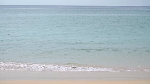 Minimalistic Shot Of Sea Tide On Sandy Beach
