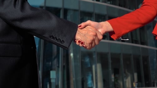 Business People Handshake Outside Office Building