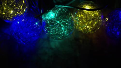 Colorful String Lights Illuminating Dark Space Close Up