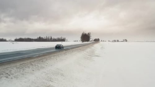 Car Driving on Winter Country Road, Aerial View From Drone in . Main Object Entry Frame.