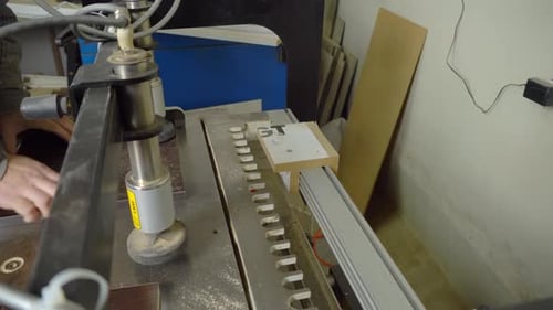 Woodworking Machine Shaping Wood Piece in Manufacturing