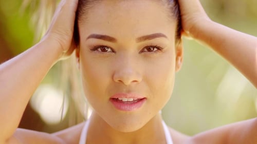 On Beautiful Woman With Hands On Hair