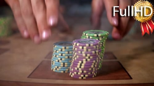 Hands Placing Stacks of Poker Chips on Table