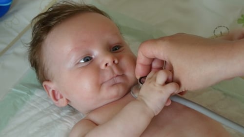 Infant Examined with Stethoscope in a Doctor's Office