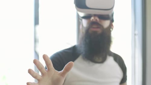 Man with VR Headset Holds Out Hand