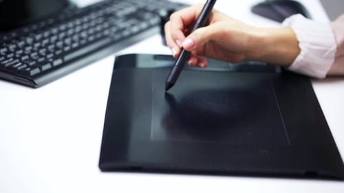 Hand Using Stylus and Tablet for Digital Art