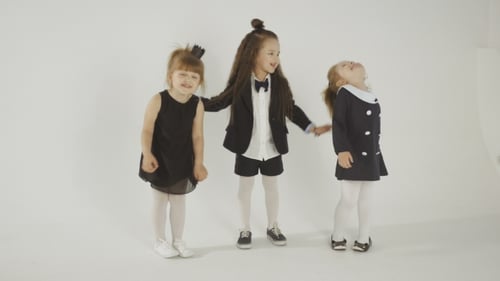 Three Cute Girls Posing Together in White Studio