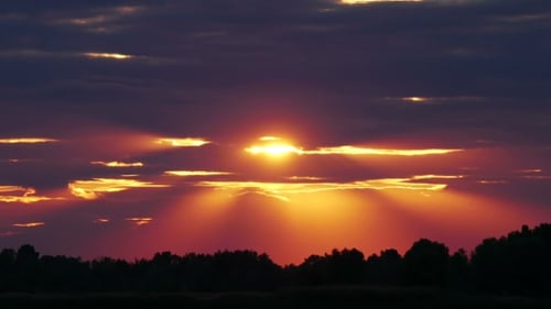 Brilliant Sunset with Light Rays and Clouds