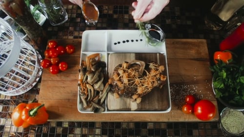 Steak Topped with Mushrooms and Fresh Rosemary