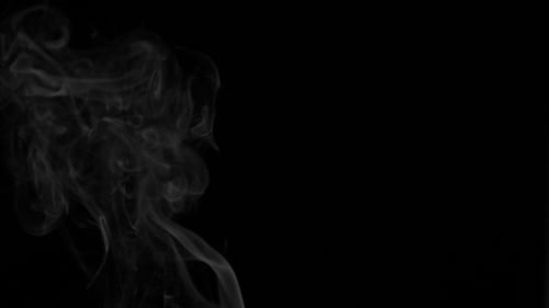 Smoke Rising Against Black Background