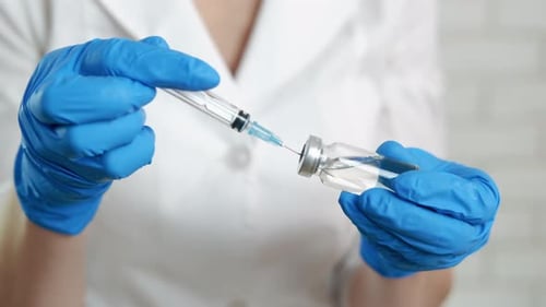 Drawing Vaccine into Syringe, Healthcare, Medical