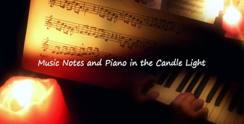 Hands Play Piano Keys Lit By Candlelight