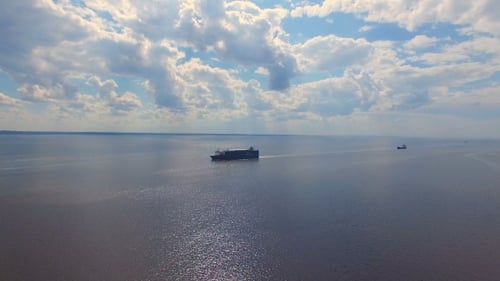 Aerial view of cargo ships floating on water
