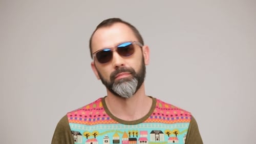 Man with Beard Wearing Sunglasses and Colorful Shirt