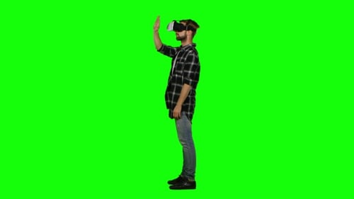 Man Wearing Virtual Reality Glasses. Green Screen