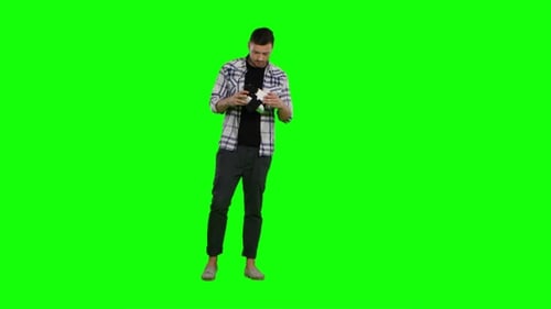 Surprised Man Uses Virtual Reality Goggles. Green Screen