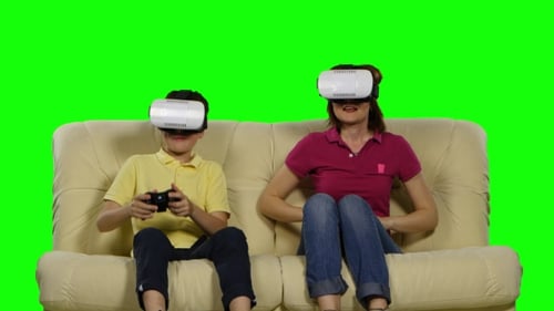 Virtual Reality Mask. Young Mother And Her Son With Pleasure Play With The Head-mounted Display