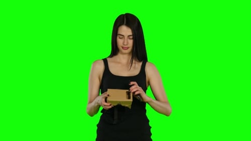Young Woman With VR Virtual Reality Headset On Her Head, Green Screen