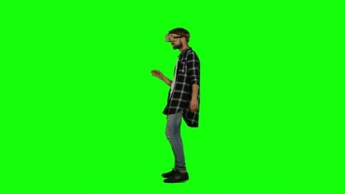 Man Experiencing Virtual Reality on Green Screen