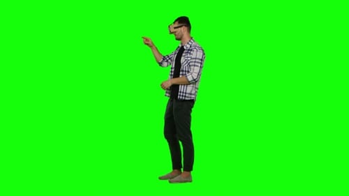 Man Using VR Headset on Green Screen