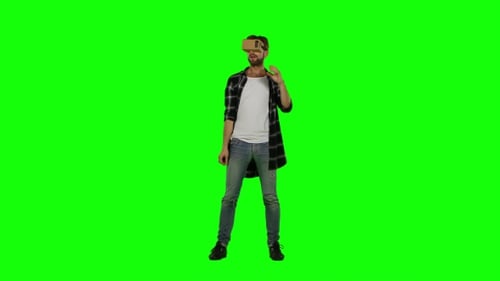 Man Using Virtual Reality Headset on Green Screen