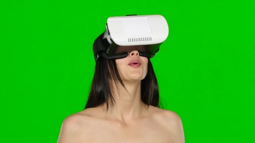 Woman Using Virtual Reality Headset, VR Mask, . Green Screen