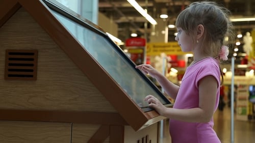 The Girl Works with a Large Tablet Touchscreen