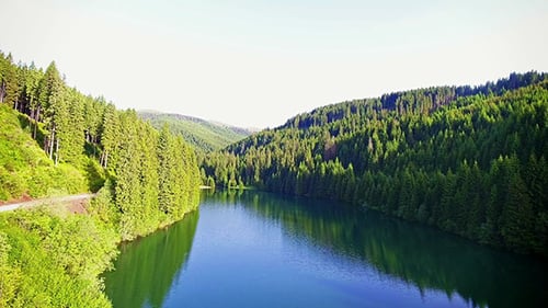 Fly Over Mountain Lake In A Sunny Day