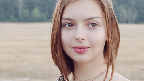Young Woman Posing in a Rural Field