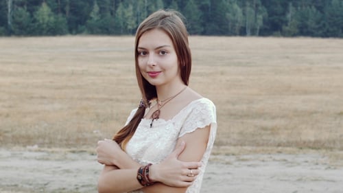 Young Woman Posing in a Rural Field