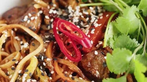 Asian Rice Noodles with Fried Meat and Spicy Vegetables Top View