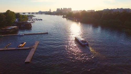 The river slowly floating tourist ship at sunset