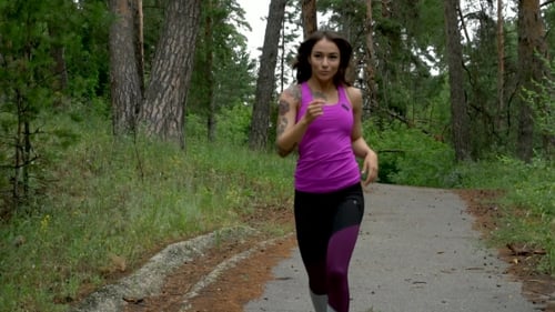 Fitness Workout Outdoors. Sport Woman Running Through The Woods. .