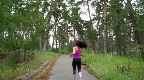 Active Weekend. Young Attractive Woman , Running Through The Park. .