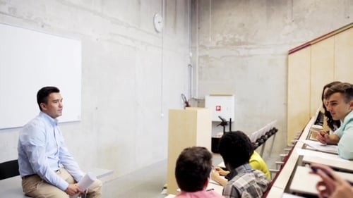 Lecturer Speaks to Students in Lecture Hall