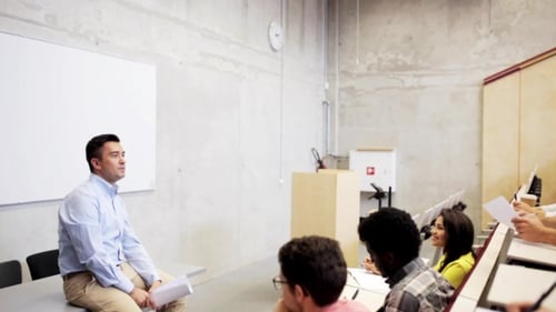 Lecturer Engaging Students in Modern Classroom Setting